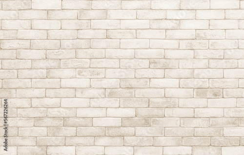 Cream and white brick wall texture background. Stonework backdrop interior design vintage old pattern with concrete uneven color beige bricks stack decoration.