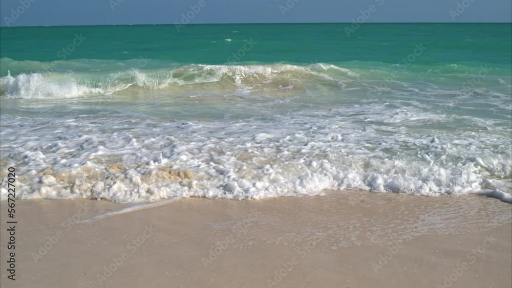 Slow motion frontal view of the sea and the waves braking at the beach in Cancun Mexico on a sunny day Slow motion frontal view of the sea and the waves braking at the beach in Cancun Mexico on a sunny day