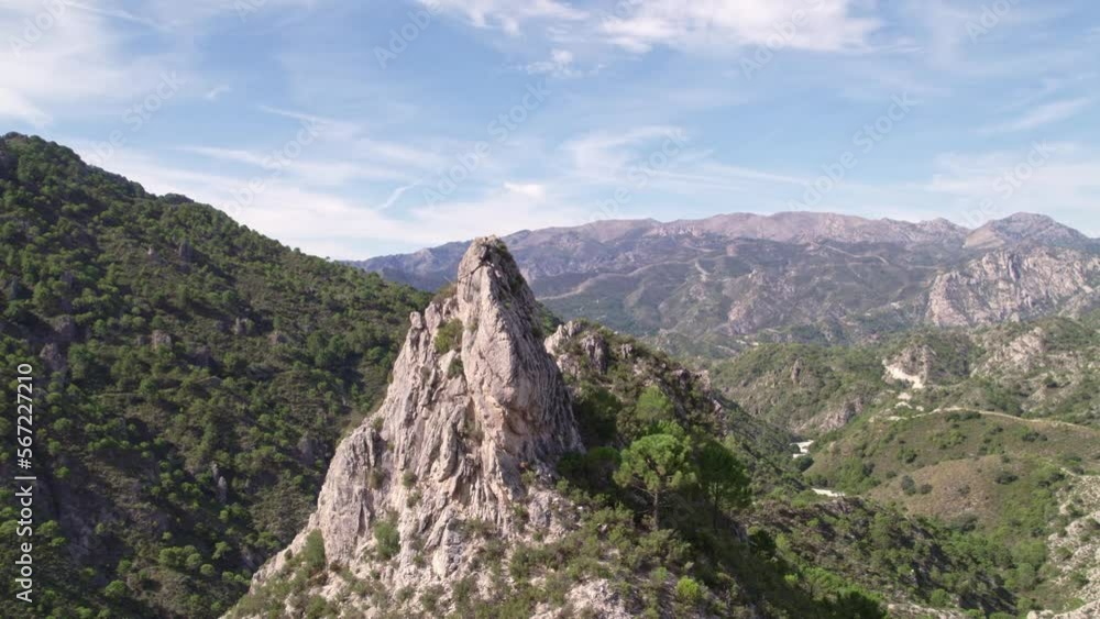 Aerial view in orbit of a high mountain peak and parallax effect with mountains and Mediterranean forest in the background. Grenade. Spain. Aerial view in orbit of a high mountain peak and parallax effect with mountains and Mediterranean forest in the background. Grenade. Spain.