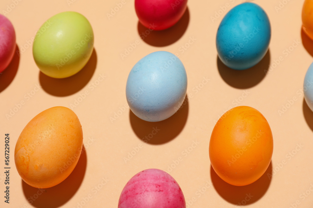 Many colorful Easter eggs on color background, closeup