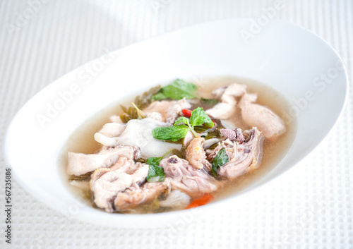 Tom Yum Chicken with Mushroom Straw on a White Bowl - selective focus