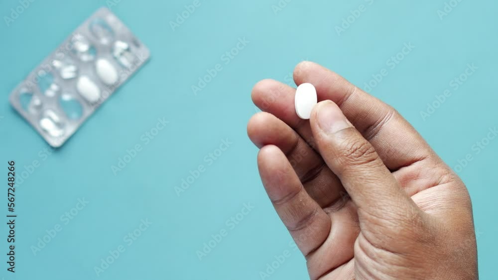 Close up of man hand holding pills with copy space Close up of man hand holding pills with copy space