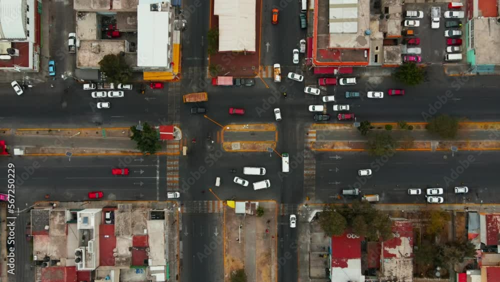 Top view road roundabout with car driving rush hour in Mexico City. Aerial view urban roundabout junction with traffic suburban mexican district. Top view road roundabout with car driving rush hour in Mexico City. Aerial view urban roundabout junction with traffic suburban mexican district.