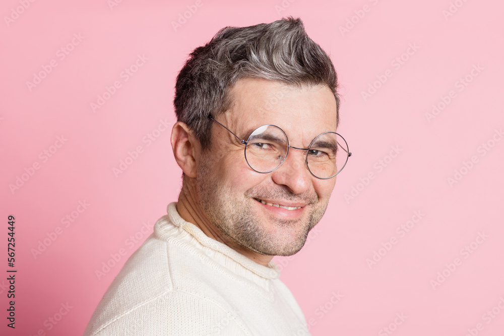 Fototapeta premium guy in round glasses on a pink background