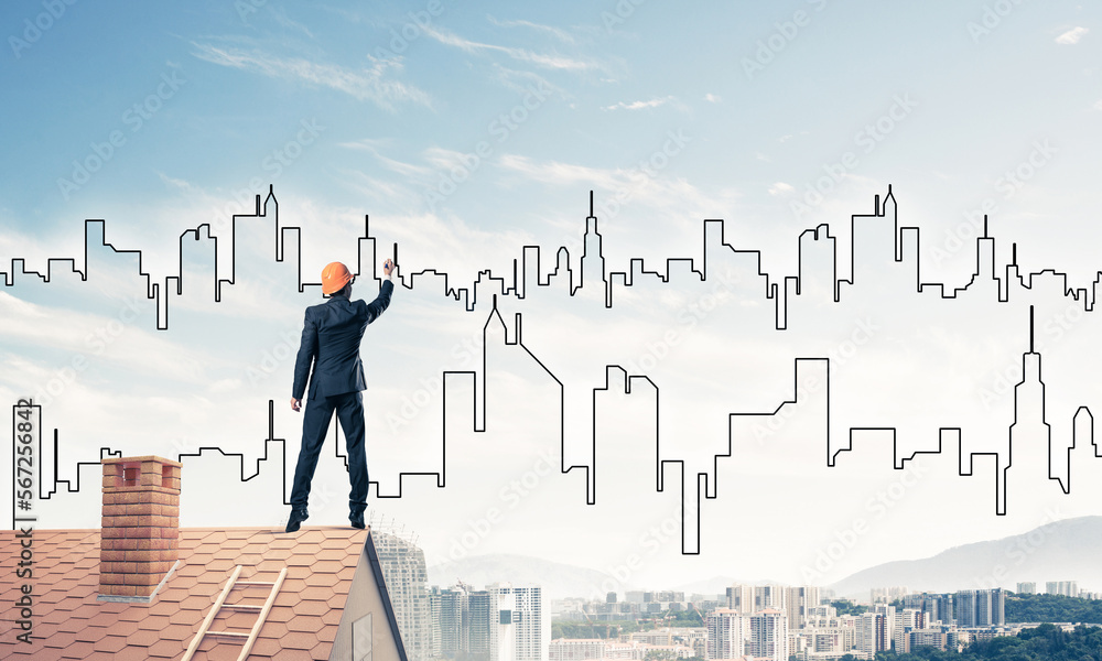 Man architect draw silhouette of modern city on blue sky. Mixed Man architect draw silhouette of modern city on blue sky. Mixed