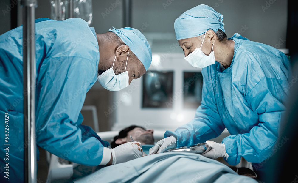 Healthcare, surgery and doctors in hospital operating room for emergency operation on patient. Health clinic, collaboration or team of medical surgeons working with surgical tools to save life of man Healthcare, surgery and doctors in hospital operating room for emergency operation on patient. Health clinic, collaboration or team of medical surgeons working with surgical tools to save life of man