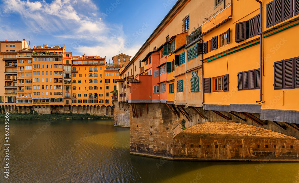 Famous Ponte Vecchio bridge with silversmith shops on Arno River, Florence Italy