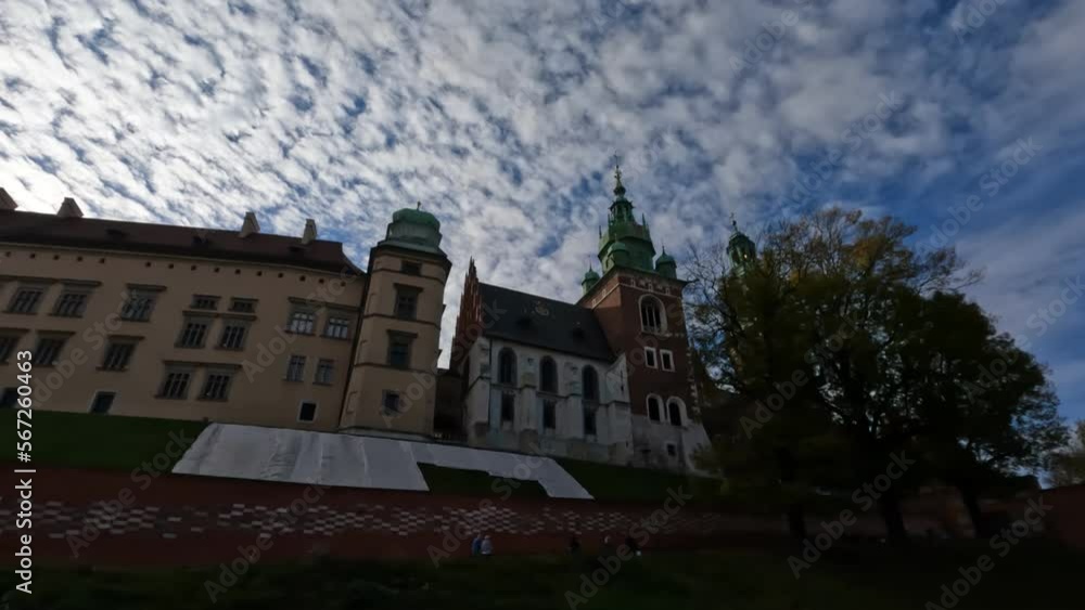 The ancient and famous Wawel Castle in the center of Krakow, and the lawn in front of it. Against a clear sky The ancient and famous Wawel Castle in the center of Krakow, and the lawn in front of it. Against a clear sky