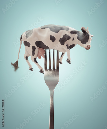 Cow on a fork. Diet and weight loss concept.