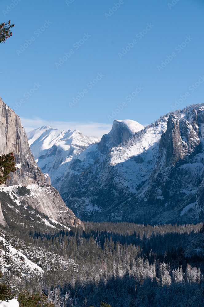 Landscape shot of Yosemite Valley, from the tunnel view lookout, showing El Capitan and Half-dome in the distance. Landscape shot of Yosemite Valley, from the tunnel view lookout, showing El Capitan and Half-dome in the distance.