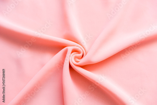 Light pastel pink folded fabric as a background