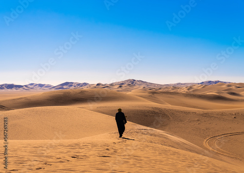 Tuareg in the sand dunes in Sahara desert, North Africa, Erg Admer, Algeria