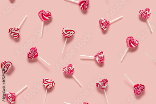 Lollipops on a pink background. Valentine's Day seamless pattern.  © Svetlana