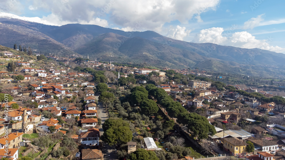 Architecture stone buildings, traditional Turkish village houses in touristic place Birgi, Izmir. Landscape with aerial drone.