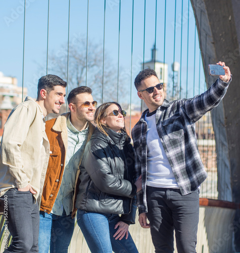 Group of cheerful young friends taking selfie portrait. Happy people looking at the camera smiling. Concept of community, youth lifestyle and friendship  © pedro