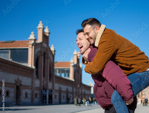 A portrait of happy gay couple outdoors 