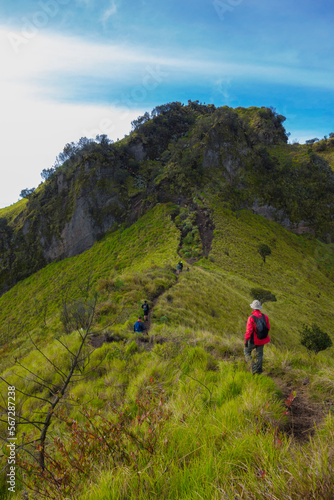 some hikers marched on foothpath to the top of Mount Merbabu
