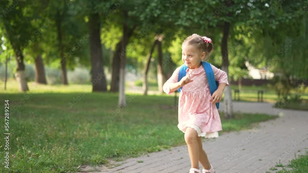 Schoolgirl back to school. Girl with backpack run through park. Schoolgirl run to school. Girl with a backpack back to school. Child learning concept. Girl hurries to school. People in park Schoolgirl back to school. Girl with backpack run through park. Schoolgirl run to school. Girl with a backpack back to school. Child learning concept. Girl hurries to school. People in park