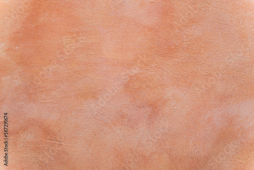 Terracotta orange texture of a wall in Italy