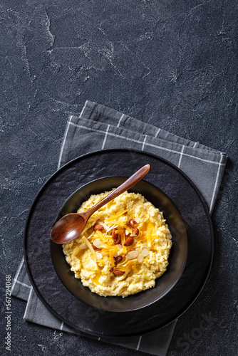 corn grits with butter, vegan cheese, and almonds