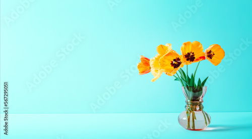 Big flowers bouquet of yellow tulips in vintage glass vase on blue background. Copy space. Business card. Invitation postcard. Mockup design. International holiday. Banner. Hello spring. 8 march
