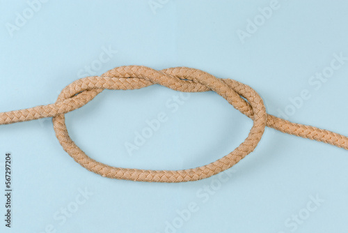 Rope knot Double overhand knot on a blue background