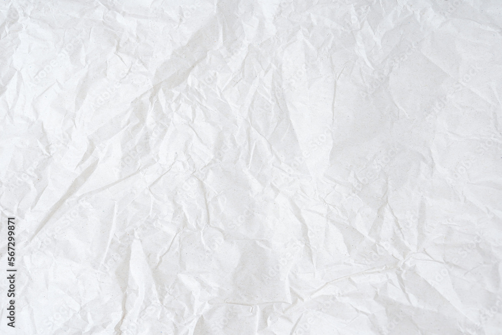 Naklejka premium Crumpled white paper background texture with place for text
