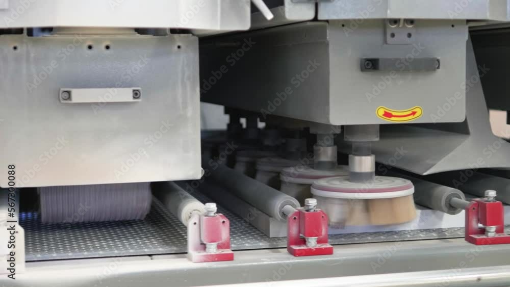 Process of painting products from glued sawdust and wood on a conveyor belt Process of painting products from glued sawdust and wood on a conveyor belt
