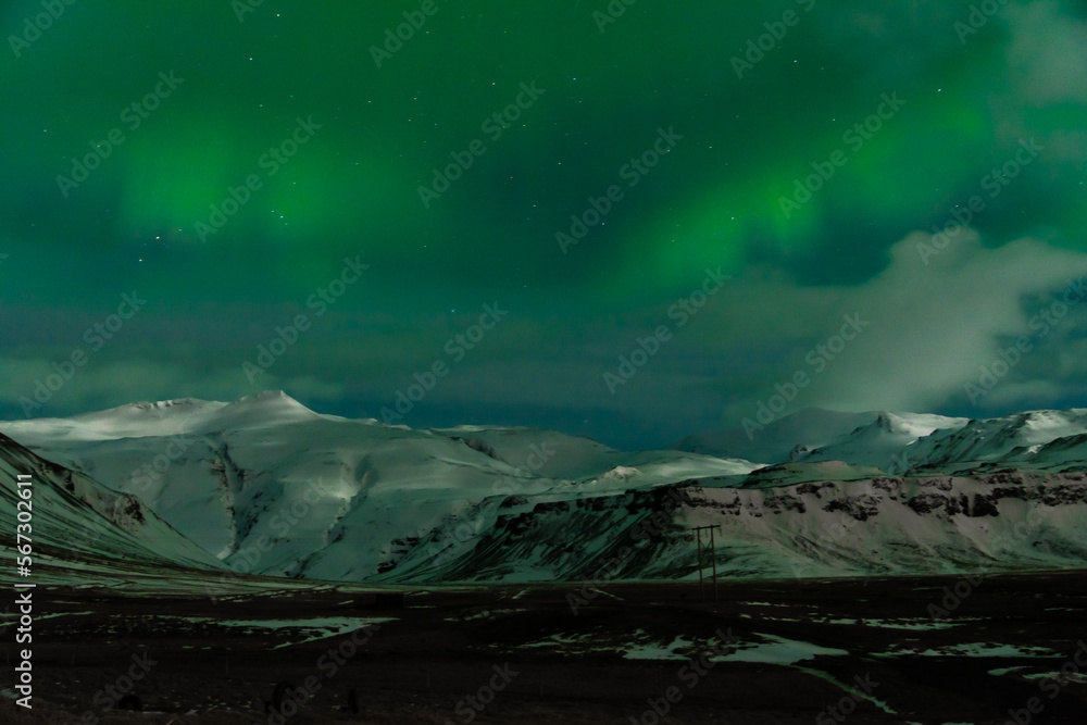 Northern lights in Iceland with green sky background