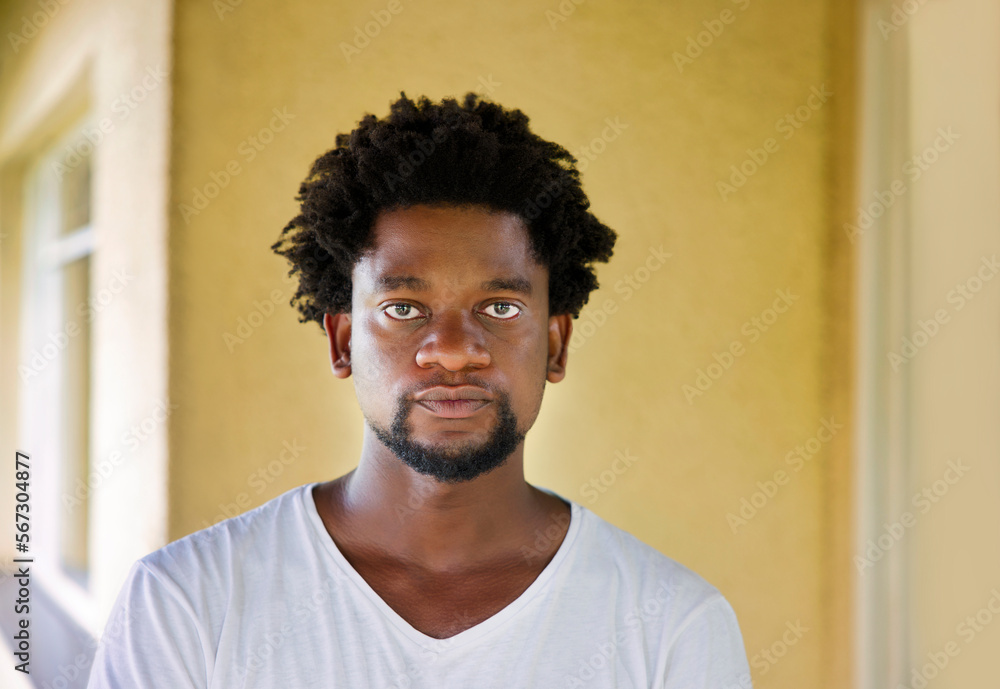 Obraz premium young african tenant standing in front of the house
