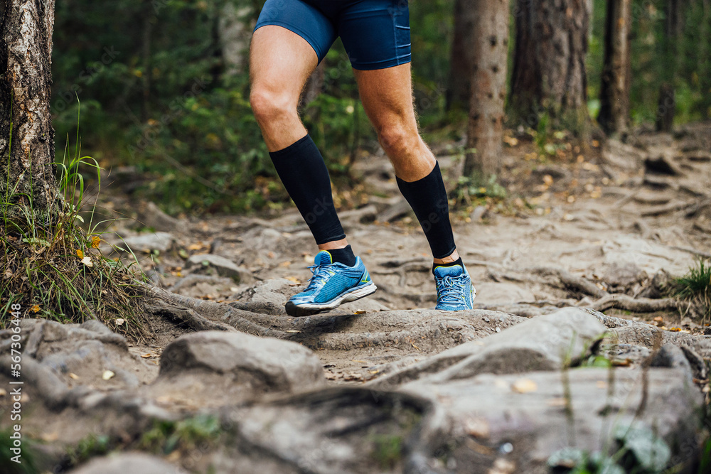 legs runner in compression calf sleeve running trail Stock Photo