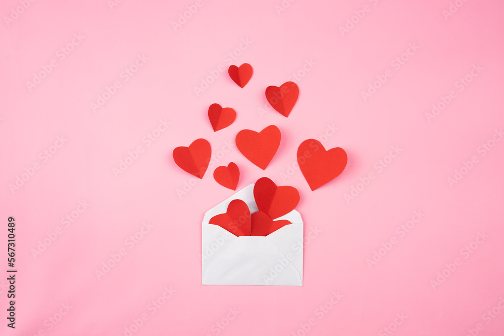 heart shape paper out of the envelope for valentine background and copy space