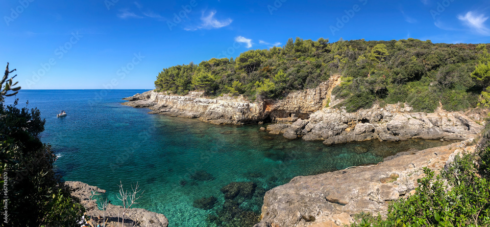 Panorama View of Turquoise Adriatic Sea at Pula. Summer Sunny Day Scenery with Crystal Clear Water with Rocky Shore in Croatia.