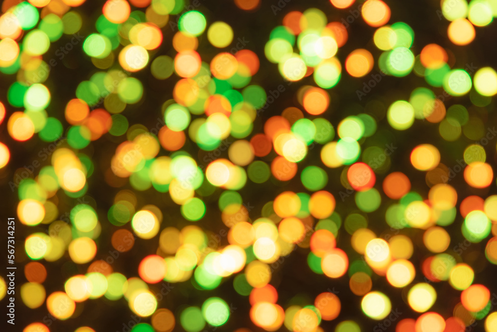 Colorful glowing drops and lights on dark background. Festive shiny glitter of blurred sequins Colorful glowing drops and lights on dark background. Festive shiny glitter of blurred sequins