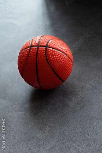 Small soft foam basketball on dark background