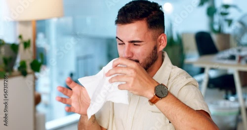 Sick, covid and man sneezing with a tissue with a virus, cold or flu in a work office. Allergy, sneeze and employee withh corona, illness or disease while working in a workspace at a startup photo