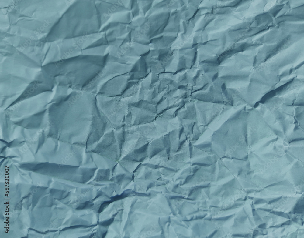 Obraz premium Abstract wrinkled or Free photo crumpled Modern crumpled blue paper or blue empty canvas on empty sheet for card, book cover, wallpaper, and any design.