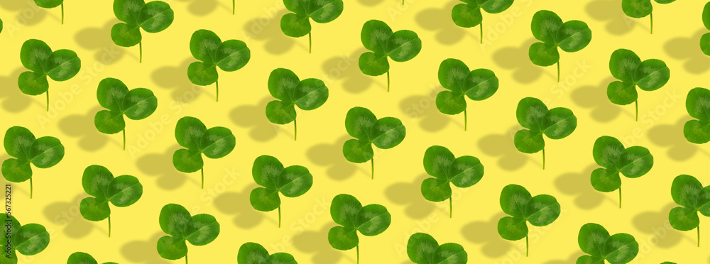 Clover leaf pattern on colored background. Abstract banner background for St. Patrick's Day