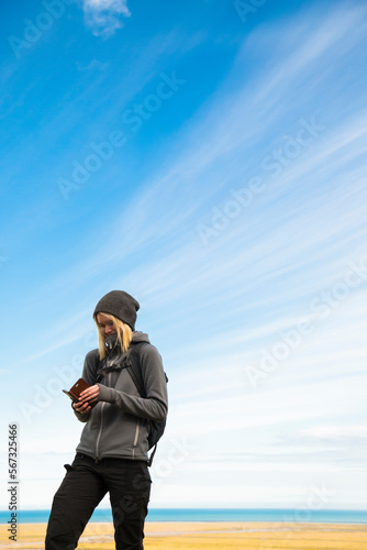Portrait of teenage girl hiking in valley in Oraefi District, Iceland photo