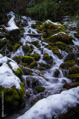 A waterfall between snowy rocks in Conguillio