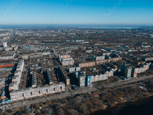 Top view of the left bank. Solnechny district, Dnipro, Ukraine. Residential houses, sleeping area. Panoramic view. Ukrainian city before the war. © Denis Chubchenko