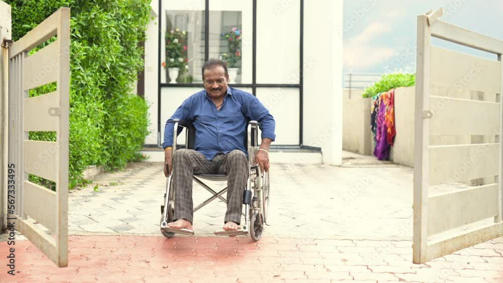 Lonely Indian senior, elder, widower living with disability, rolling wheelchair outside old age home. Retired male go out of rehabilitation clinic for leisure activity. Health care illness old age Lonely Indian senior, elder, widower living with disability, rolling wheelchair outside old age home. Retired male go out of rehabilitation clinic for leisure activity. Health care illness old age