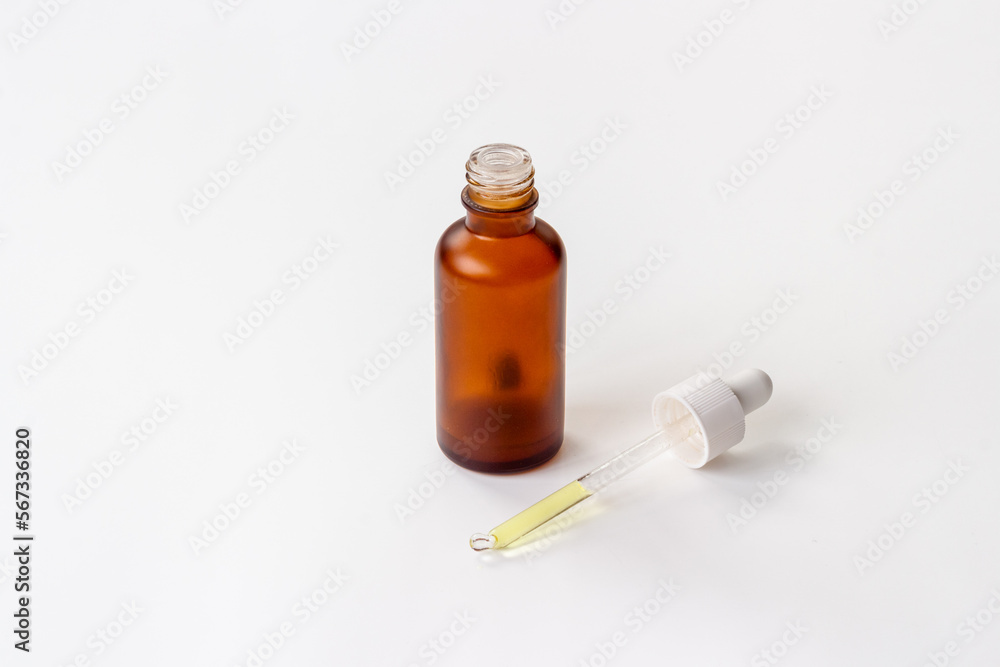 Cosmetic products concept - face serum essential oil in dropper bottle Cosmetic products concept - face serum essential oil in dropper bottle