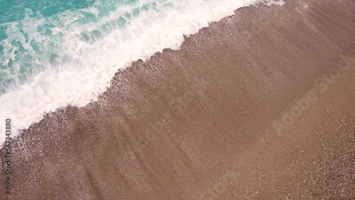 Top view of Oludeniz beach with turquoise sea and waves. Oludeniz - Fethiye, Mugla, Turkey. photo