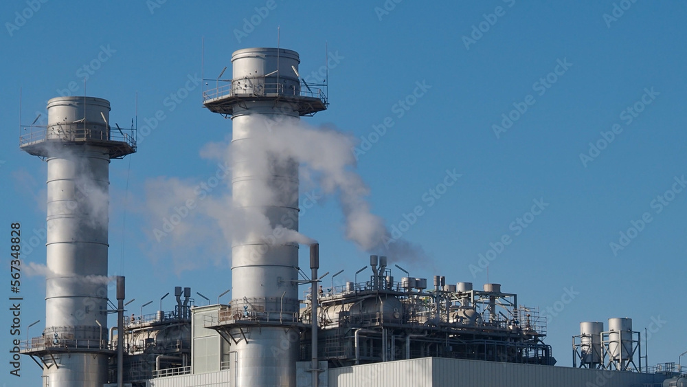 Detail of power factory making smoke toxic in nature through the chimneys .Pollution, CO2 emissions Detail of power factory making smoke toxic in nature through the chimneys .Pollution, CO2 emissions