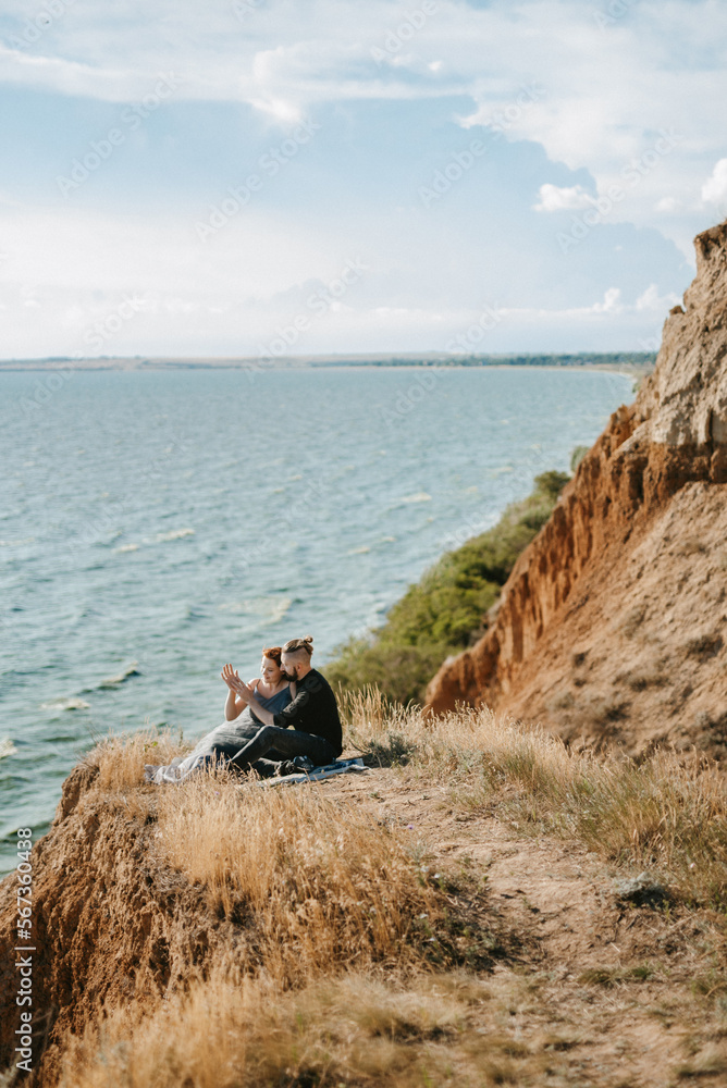 Obraz premium pregnant girl and boyfriend on high hills