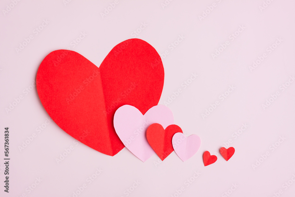 Red and Pink Paper Hearts on pink background, Heart shape papercut , Happy Valentine's day