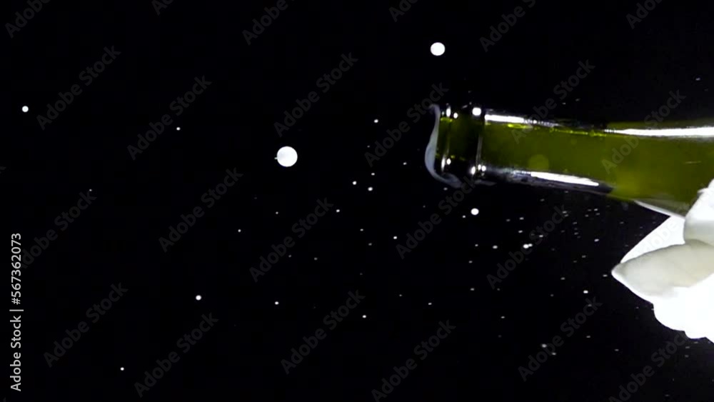 Super slow motion shot of champagne explosion, opening champagne bottle closeup. Filmed on high speed cinema camera, 4k1000fps