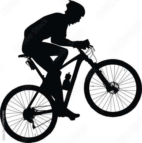 man cyclist mountain biker riding uphill black silhouette