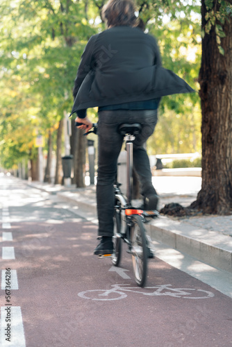 Man Riding Bike in Street